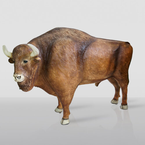 Large, lifelike statue of a bison with realistic texture and coloration.