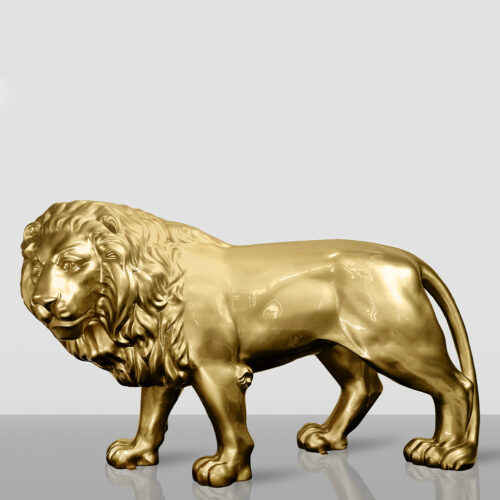 Golden lion statue standing on a reflective surface.