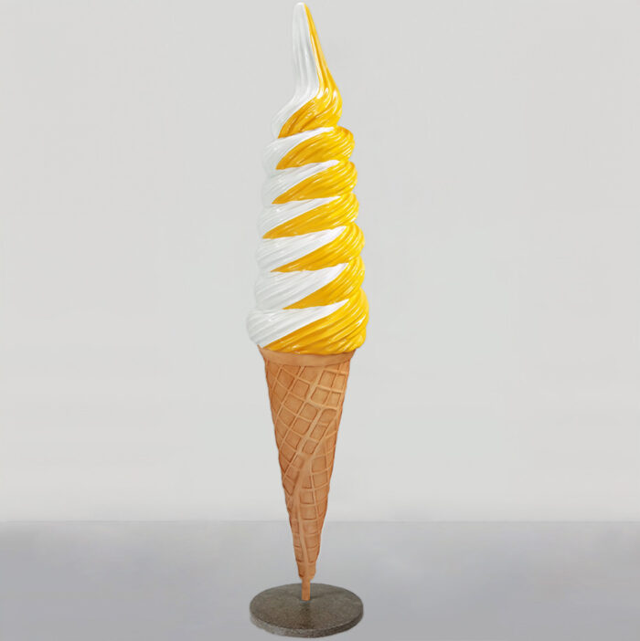 Statue of a tall vanilla and orange twist soft-serve ice cream cone on a gray circular base.