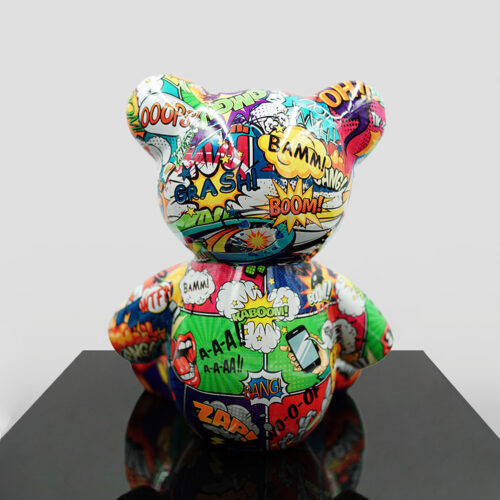 Colorful bear-shaped sculpture with a comic book style design featuring words like