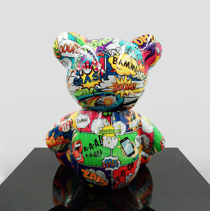 Colorful bear-shaped sculpture with a comic book style design featuring words like "BANG," "BOOM," and "CRASH."