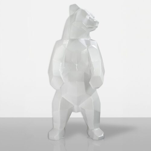 White geometric bear sculpture standing on a smooth surface.