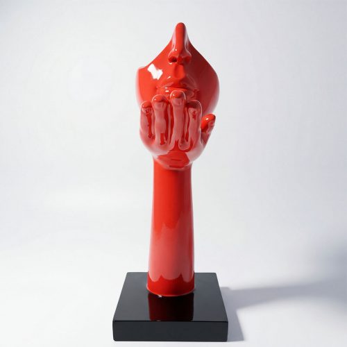 sculpture face and hand in glossy red fiberglass with stylized modern design on black base for decor or advertising