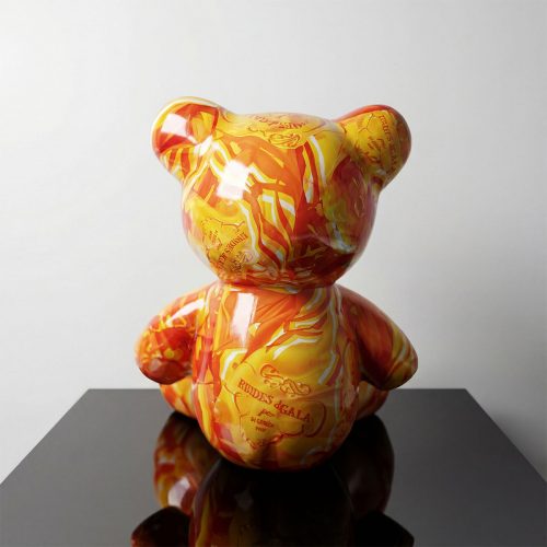 figure bear sculpture in glossy orange and yellow marbled fiberglass with decorative script, for retail or event display