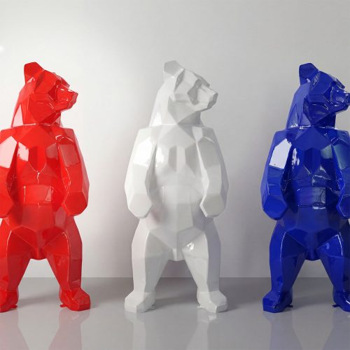 Figure bear sculpture trio in glossy red, white, and blue fiberglass with geometric faceted modern style for decor or advertising