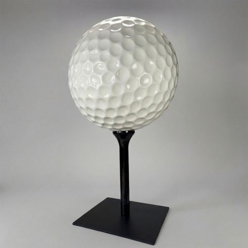 figure golf ball sculpture in glossy white fiberglass with dimpled texture on black pedestal for advertising or decor