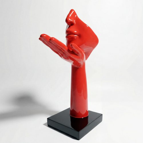 sculpture face and hand figure in glossy red fiberglass with modern stylized profile, on black base for decor or advertising