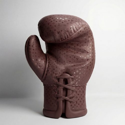sculpture boxing glove in brown fiberglass with luxury monogram pattern, decorative advertising piece for retail or events