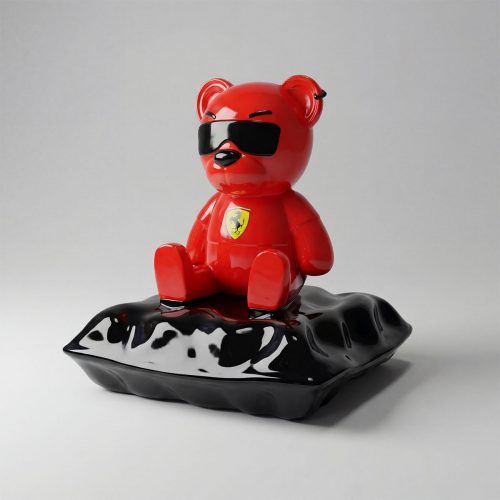 sculpture bear figure in glossy red fiberglass with black sunglasses and yellow logo, modern decorative piece for advertising or interiors