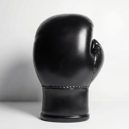 figure boxing glove sculpture in glossy black fiberglass with stitched detail, modern decorative or advertising display