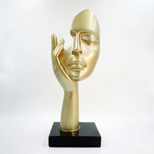 sculpture face figure in gold fiberglass with stylized hand resting on cheek, modern decorative piece for interior or showroom