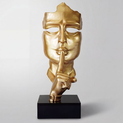 sculpture face figure in gold fiberglass with finger to lips shushing gesture, modern decorative piece for interior or event display