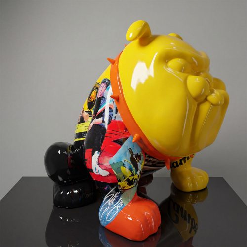 sculpture bulldog figure in glossy fiberglass, bright yellow head and multicolored collage body, modern decorative or advertising use