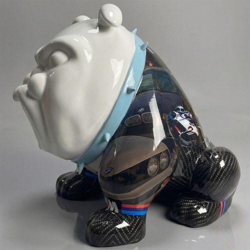 sculpture bulldog in glossy fiberglass/laminate with white head, blue spiked collar and carbon-fiber patterned legs featuring automotive graphics for advertising or decor