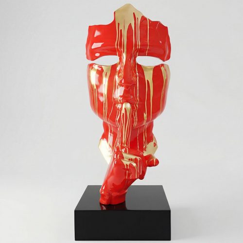 sculpture face figure in glossy red fiberglass with gold drips and stylized broken mask design for interior or advertising display