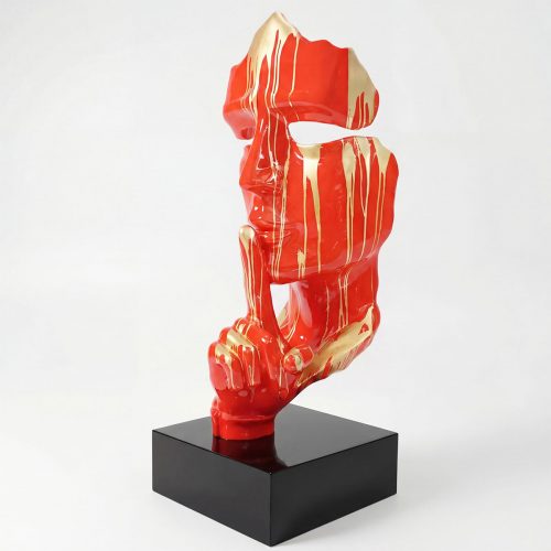 sculpture face figure in glossy red fiberglass with gold drip accents, abstract contemporary style for interior or mall display