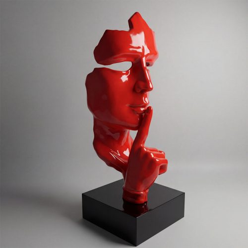 sculpture face figure in glossy red fiberglass showing fragmented profile with finger to lips, modern decorative display