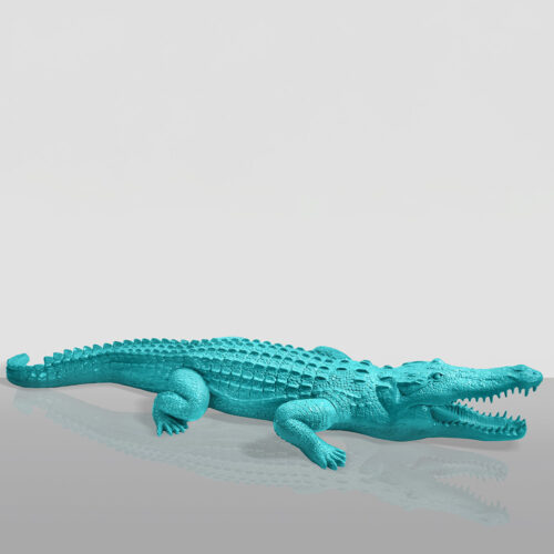 A turquoise alligator sculpture with its mouth open, displayed against a light grey background.