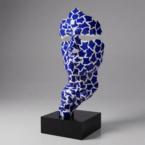 sculpture face figure in blue-and-white geometric pattern fiberglass on black plinth, modern decorative or retail display