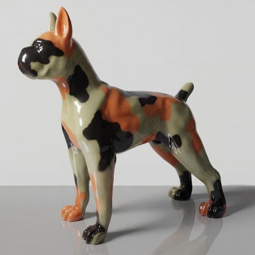 figure dog sculpture in glossy fiberglass with camo-like orange, black and olive abstract spots for decor or advertising