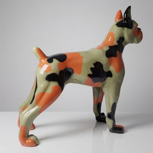 figure dog sculpture in glossy fiberglass with orange black and pale green camo pattern, modern decorative piece for retail or events