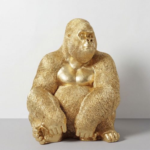 figure gorilla sculpture in gold laminate or fiberglass, textured realistic style for interior decor or retail display