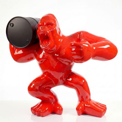 glossy red fiberglass figure gorilla holding black barrel, pop-art style sculpture for advertising or mall display