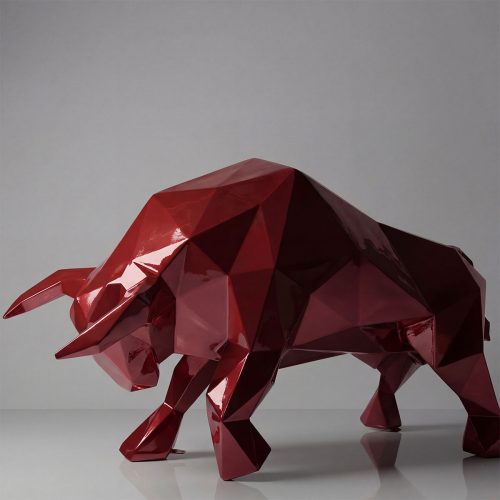 figure bull sculpture in glossy red geometric fiberglass style for advertising or modern interior decoration