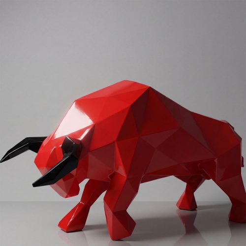 figure bull sculpture in glossy red fiberglass with black horns, geometric modern style for advertising or interior decor