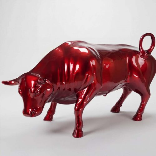 figure bull sculpture in glossy red fiberglass with stylized realistic form for mall or event advertising