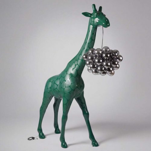 figure giraffe sculpture in glossy green fiberglass with stylized spots holding a silver chrome orb cluster, for decor or advertising