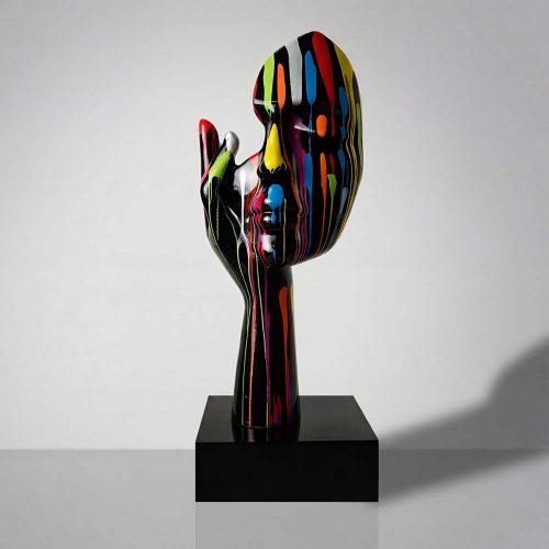 sculpture head and hand figure in glossy black fiberglass with multicolor paint drips, modern decorative piece for interiors or events
