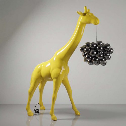 figure giraffe sculpture in glossy yellow fiberglass holding metallic bubble pendant, modern decorative piece for interiors or events