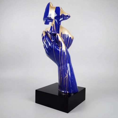 figure hand and fox sculpture in blue and gold fiberglass with glossy dripped finish for decor or advertising