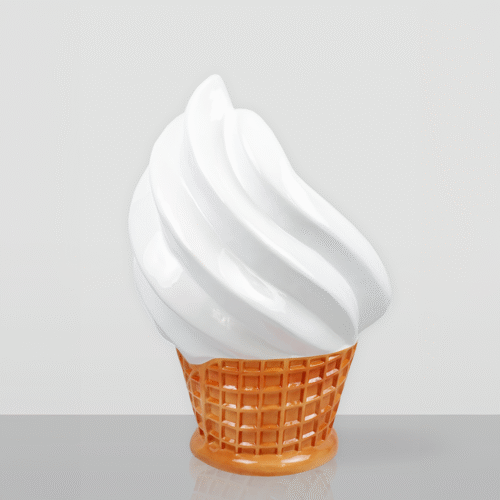 White soft-serve ice cream in a light brown waffle cone set against a plain gray background.
