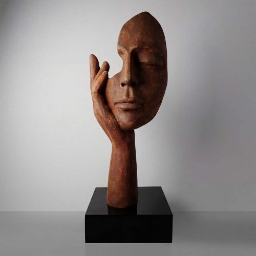figure face sculpture in brown fiberglass/laminate with hand resting on cheek, modern artistic decor for gallery or lobby
