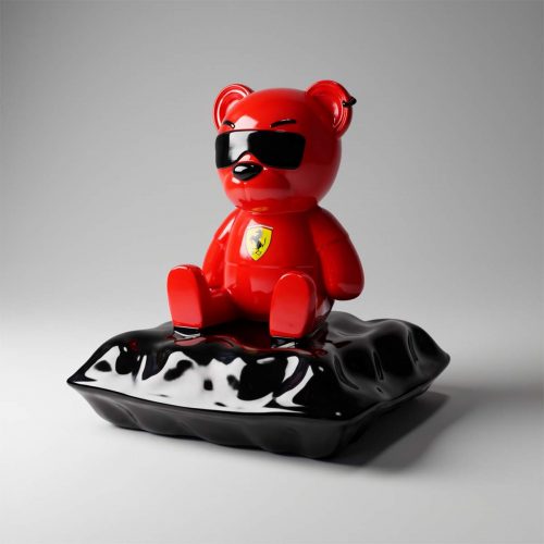 Ferrari Teddy Bear sitting on a pillow