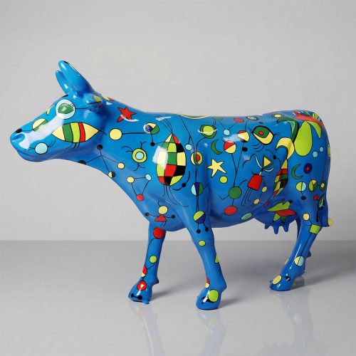 sculpture cow figure in glossy blue fiberglass with colorful abstract shapes and stars, decorative or advertising display