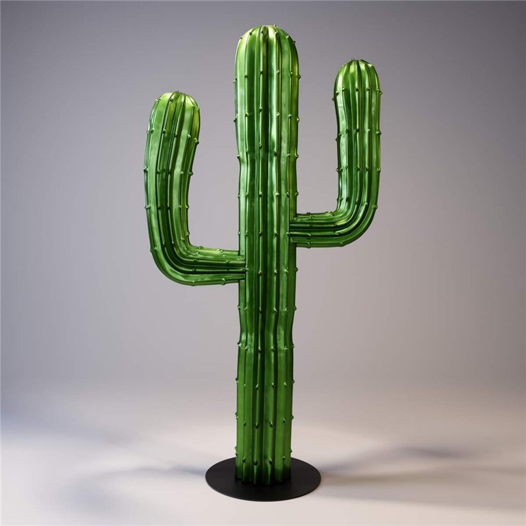 Large green cactus sculpture placed indoors with other potted cacti.